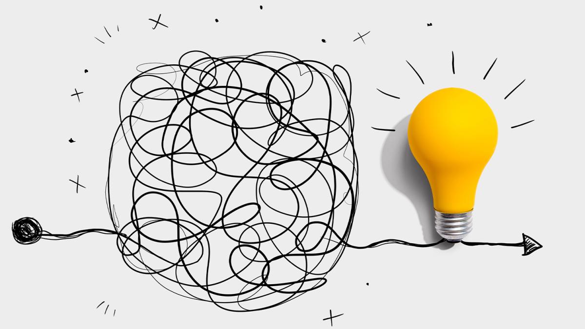 Tangled scribble transforming into a bright yellow lightbulb, symbolizing clarity or idea formation.