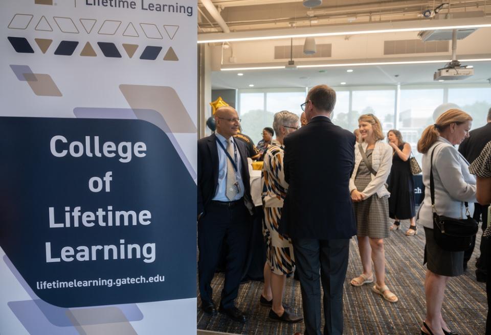 President Cabrera speaking during the Institute Address with the logo of the College of Lifetime Learning
